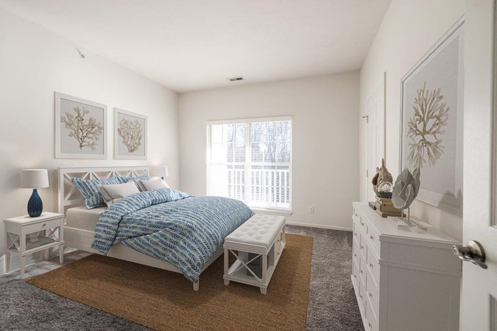 a bedroom with a bed and a dresser