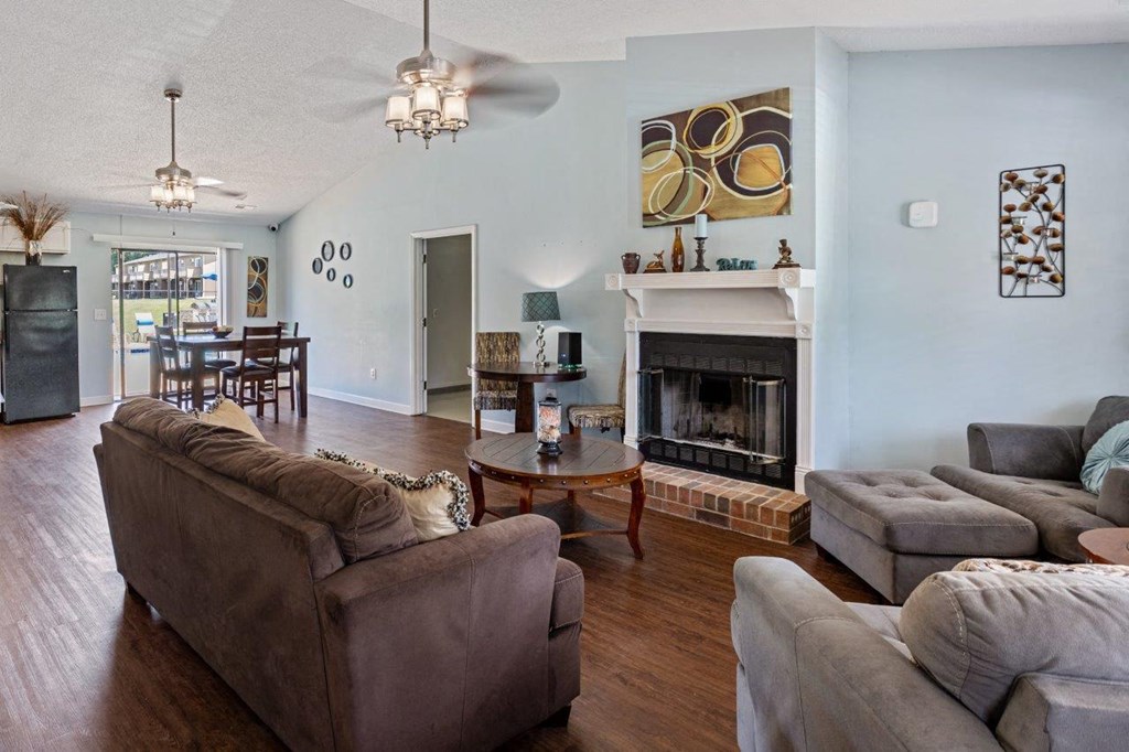 a living room with couches and a fireplace