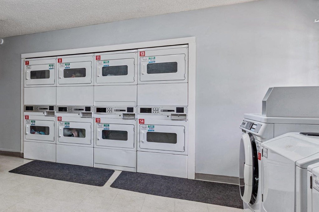 the appliances in the laundry room are lined up against the wall