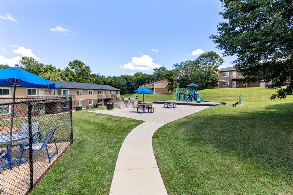 our apartments have a playground and a picnic area with tables and chairs