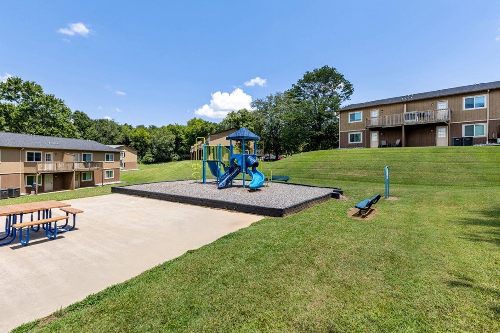 our apartments have a playground and a picnic table