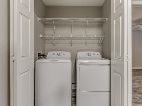 A laundry room with a washer and dryer.