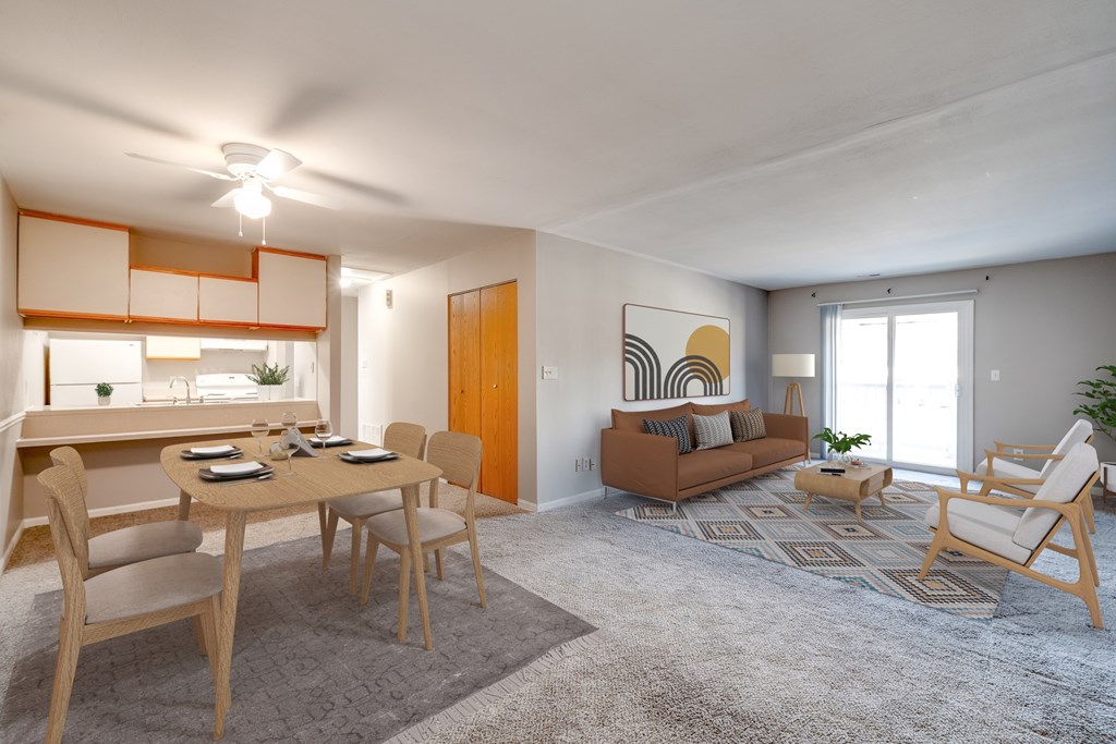 A living room with a dining table and chairs.