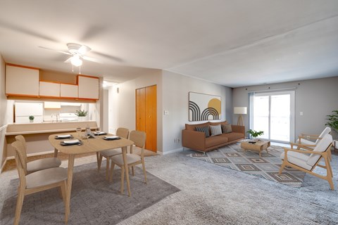 A living room with a dining table and chairs.