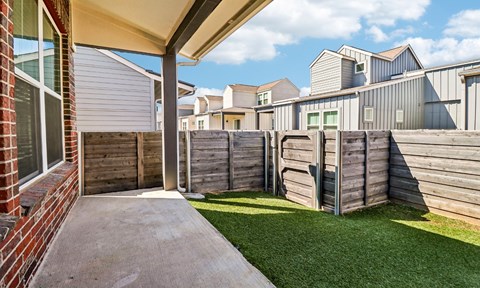 A wooden fence in front of a house.