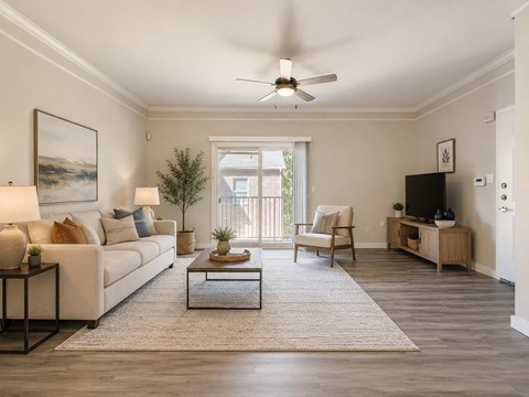 A living room with a couch, chair, and a coffee table.