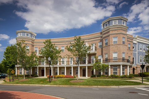 a large brick building on the corner of a street