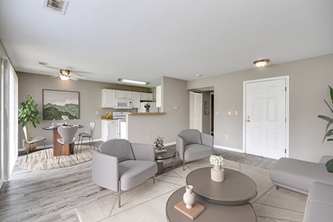A living room with a grey couch and a coffee table.