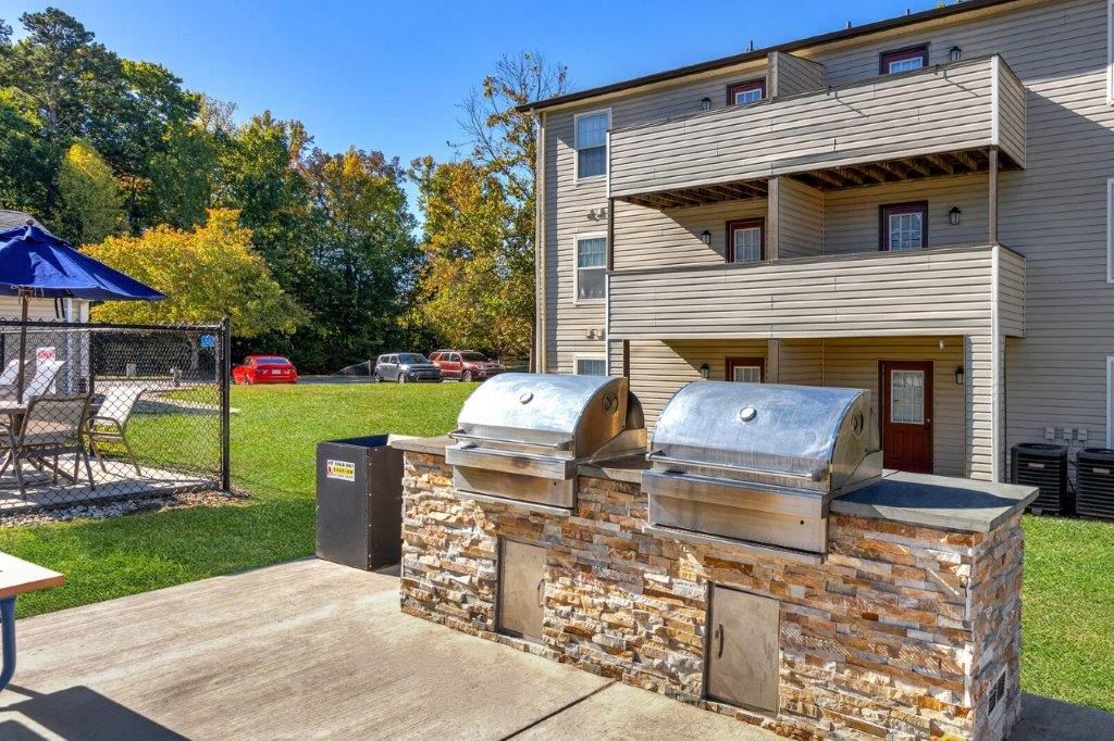 grilling area next to apartment homes