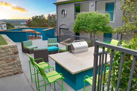 A patio with a table and chairs.