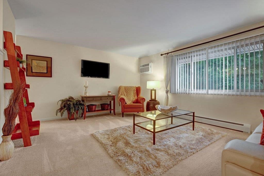 a living room with a couch and a table