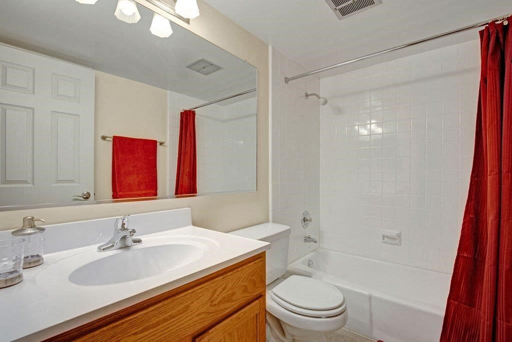 a bathroom with a sink toilet and a shower