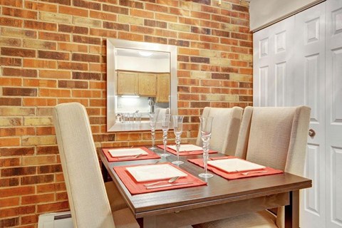 a dining room with a table and chairs