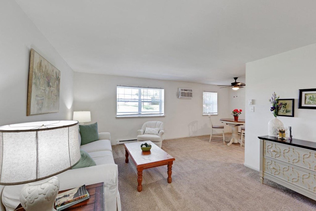 a living room with a couch and a table
