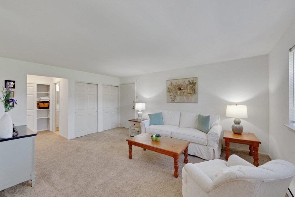 a living room with a couch and a table