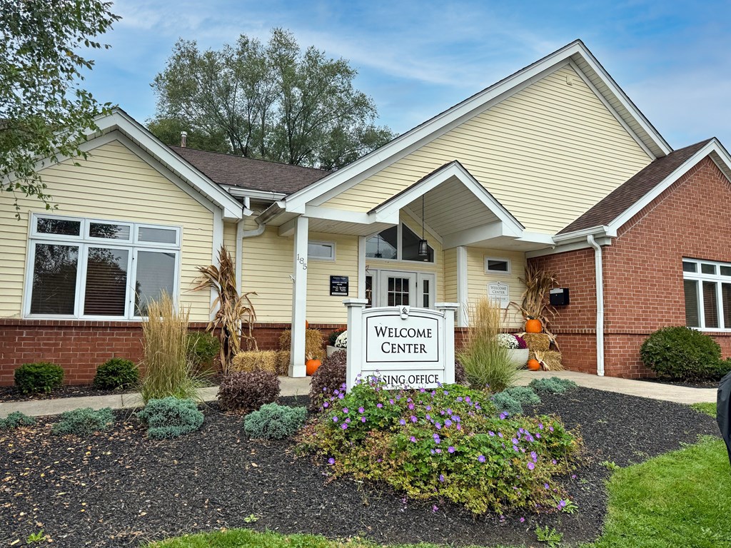 A building with a sign that says Welcome Center.