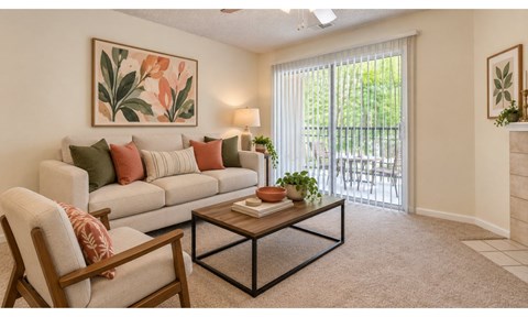 A living room with a sofa, a chair, and a coffee table.