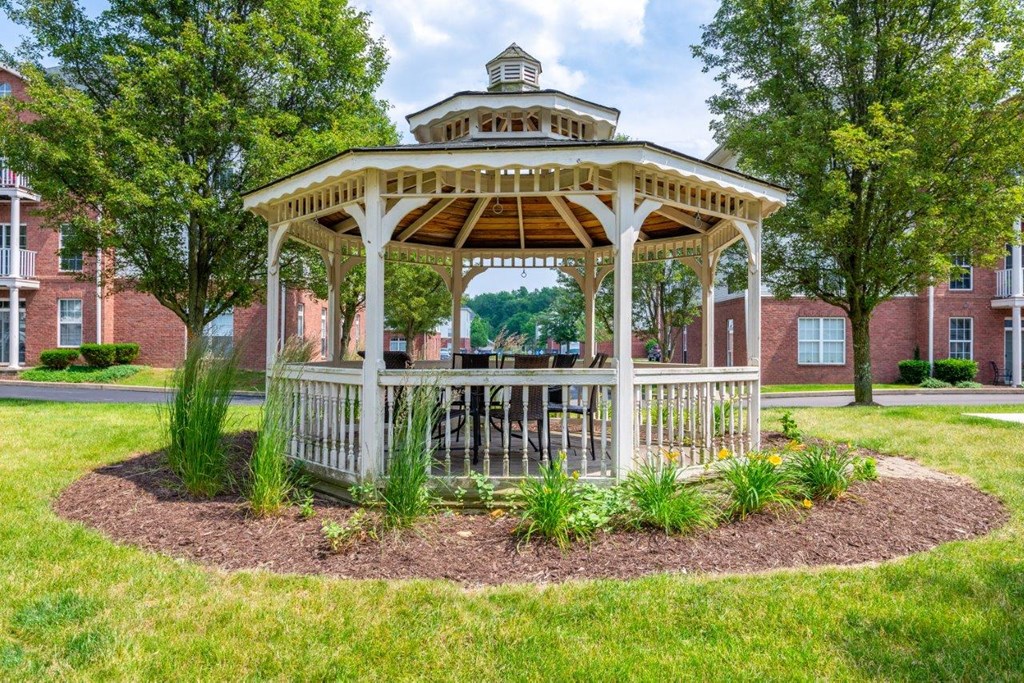 a gazebo in the middle of a grassy area