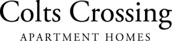 A black and white image of a sign that says Colts Crossing Apartment Homes.