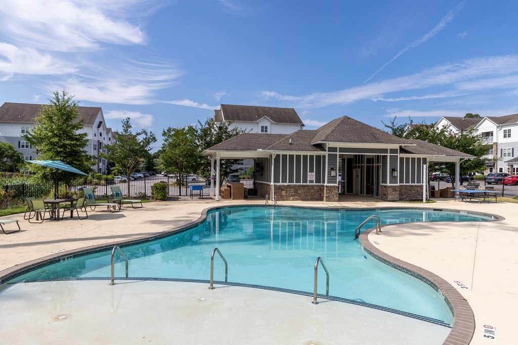 the preserve at ballantyne commons pool and clubhouse with apartment buildings