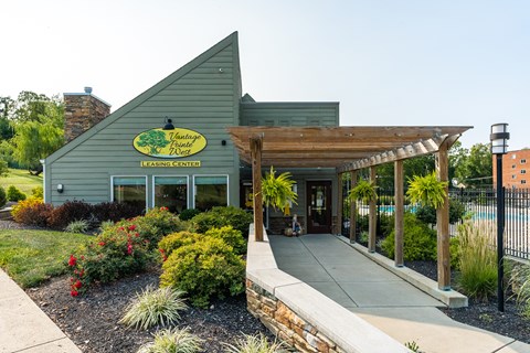 A building with a green sign that says "Leasing Center".