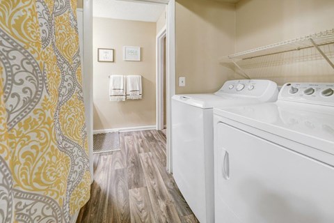 A laundry room with a washer and dryer.