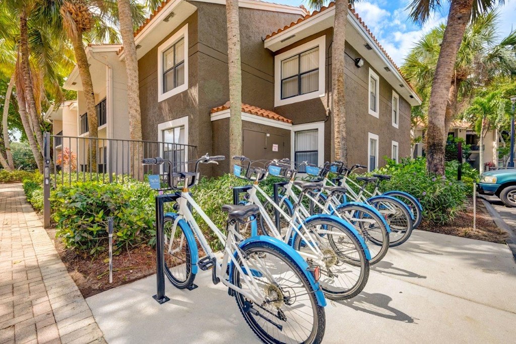 a group of bikes parked in front of a building