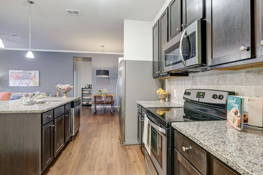 Kitchen with Stainless steel appliances and granite counter tops