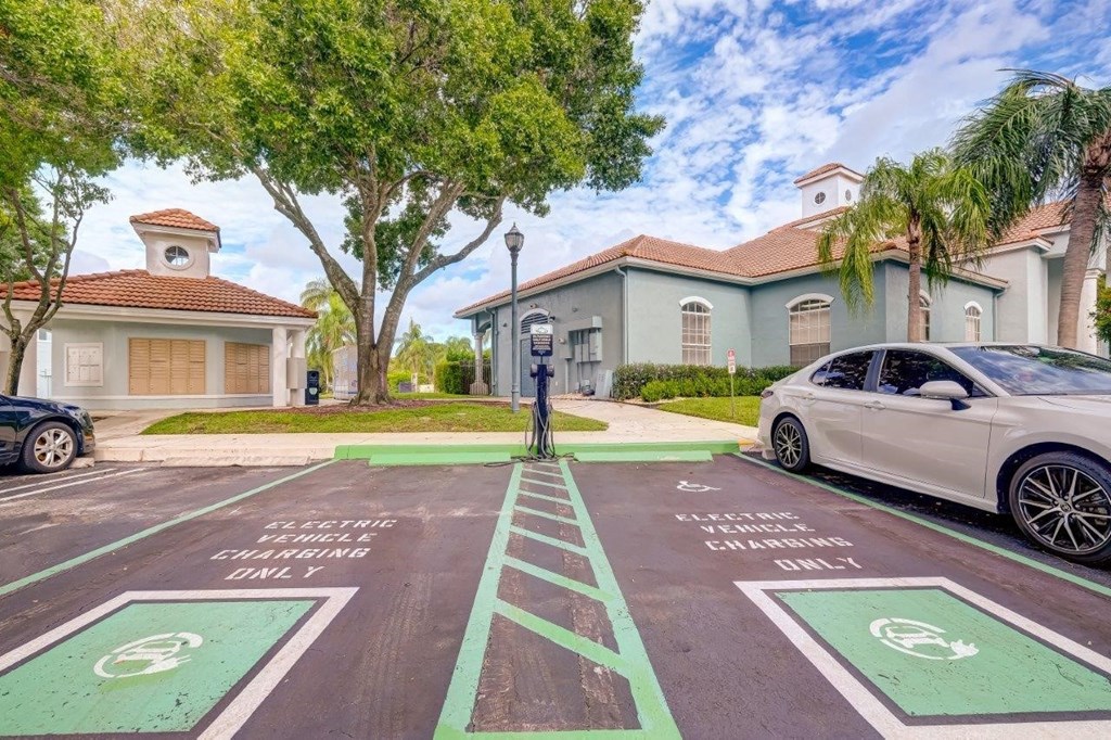a car parked in a parking lot in front of a house