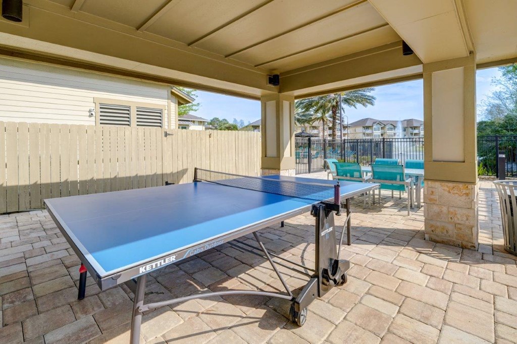 the patio has a ping pong table