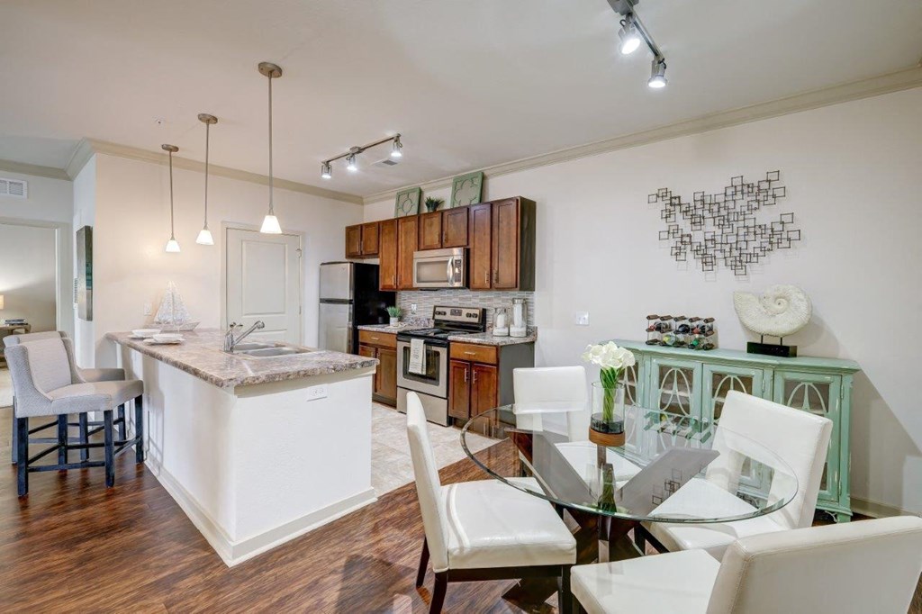 a kitchen and dining area in a 555 waverly unit