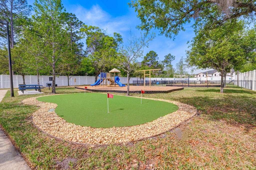 a park with a playground and a mini golf course