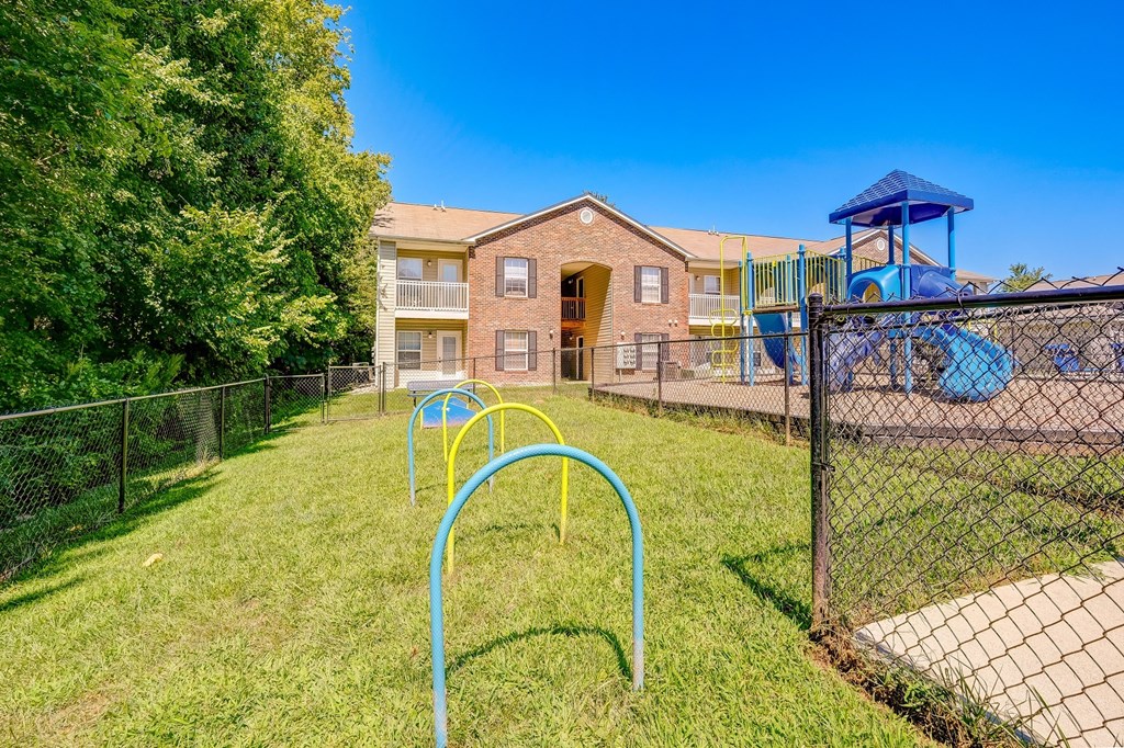 our apartments have a fenced in yard with a playground