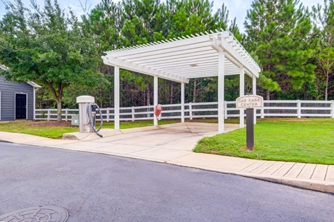 the pavilion at the end of the driveway of a parking lot