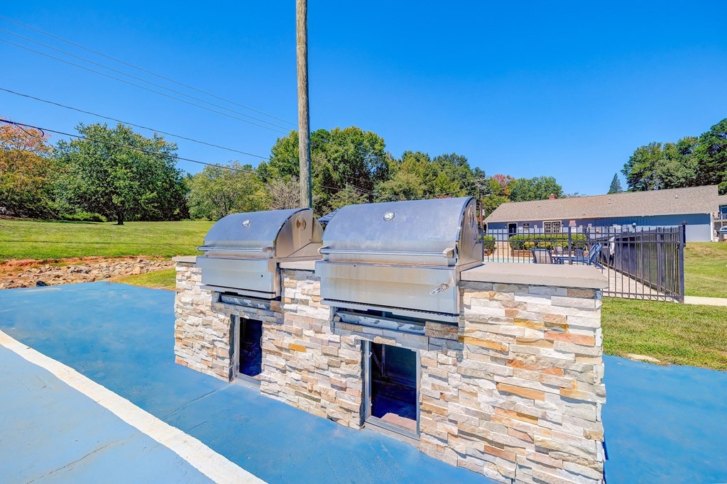 two bbq pits on the roof of a house