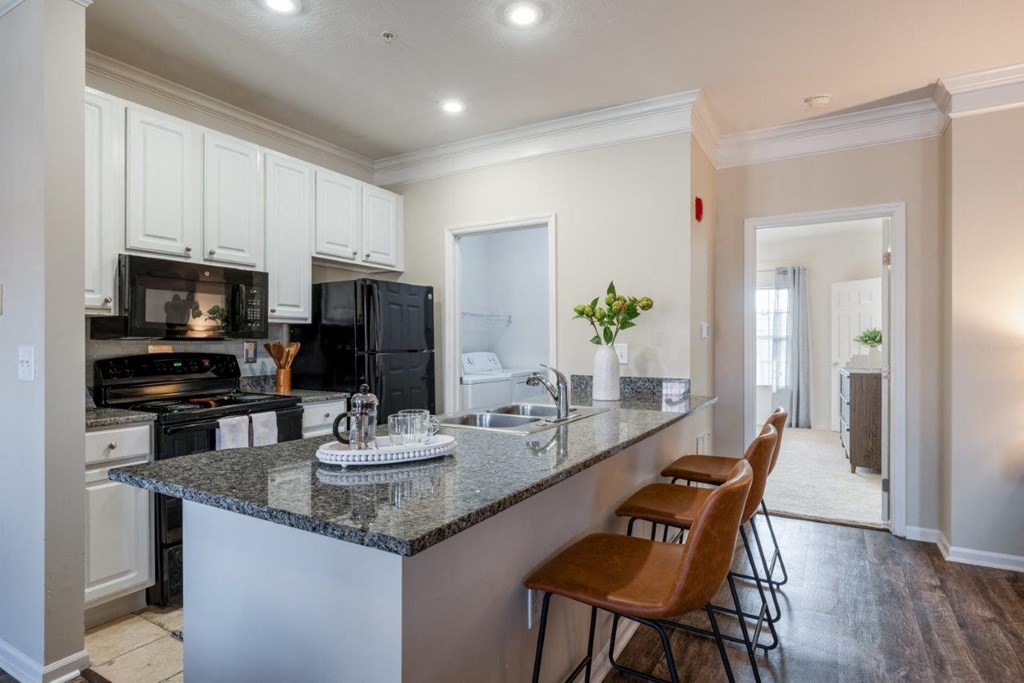a kitchen with a counter top and a sink