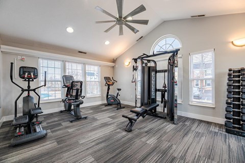A spacious home gym with a variety of exercise equipment.