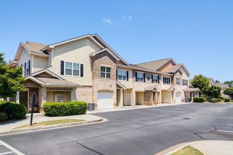 an empty street in front of a house