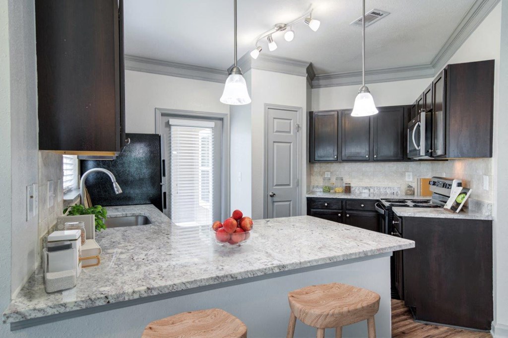 a kitchen with a counter top and a sink