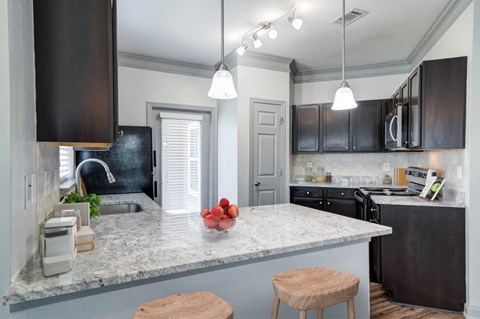 a kitchen with a counter top and a sink