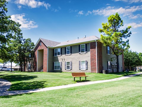 A building with a bench in front of it.