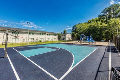 A basketball court with a blue surface and white lines.