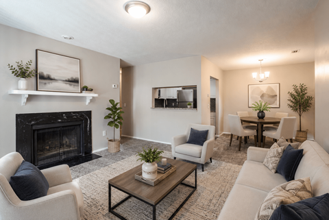 A living room with a fireplace and a couch.