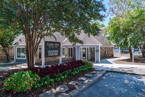 A leasing center named Gable Hill is surrounded by a well-maintained garden.