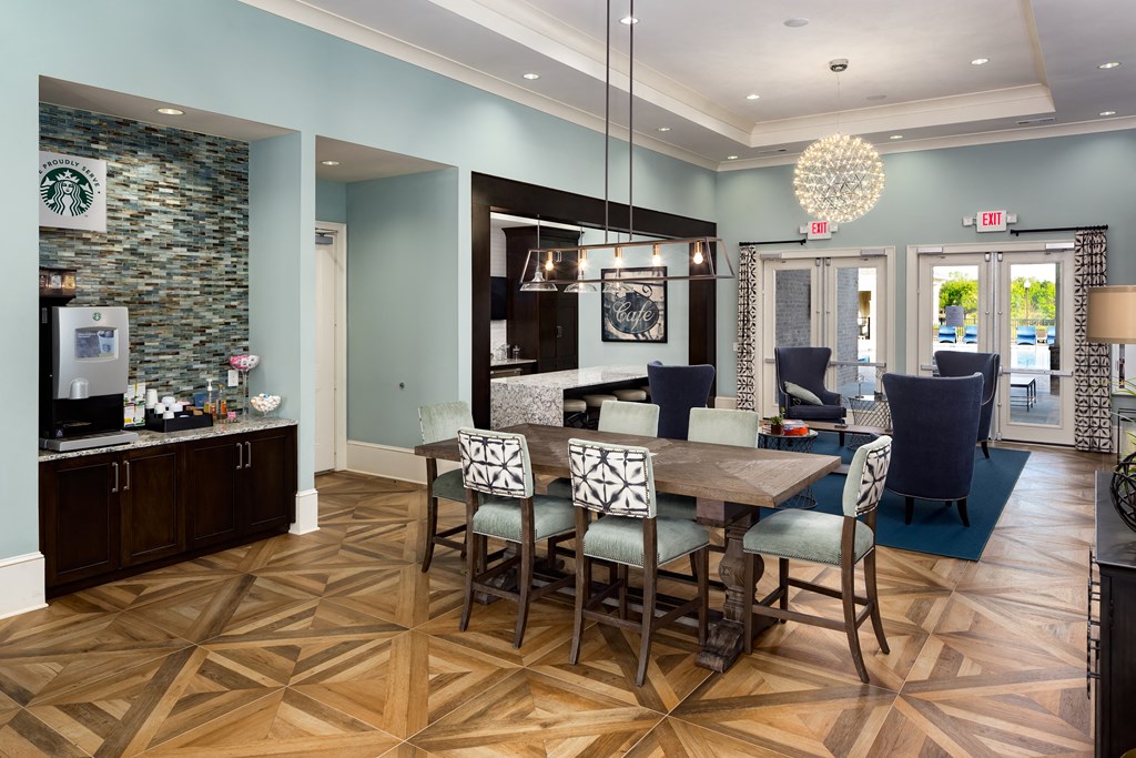 a dining room with a wooden table and chairs