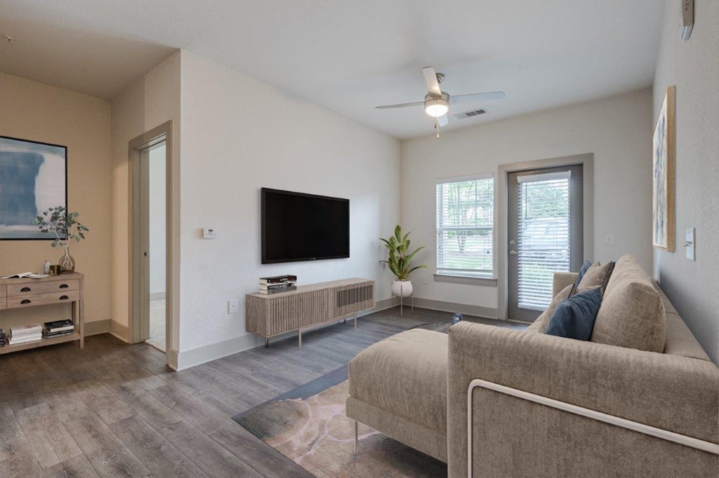 a living room with a couch and a tv