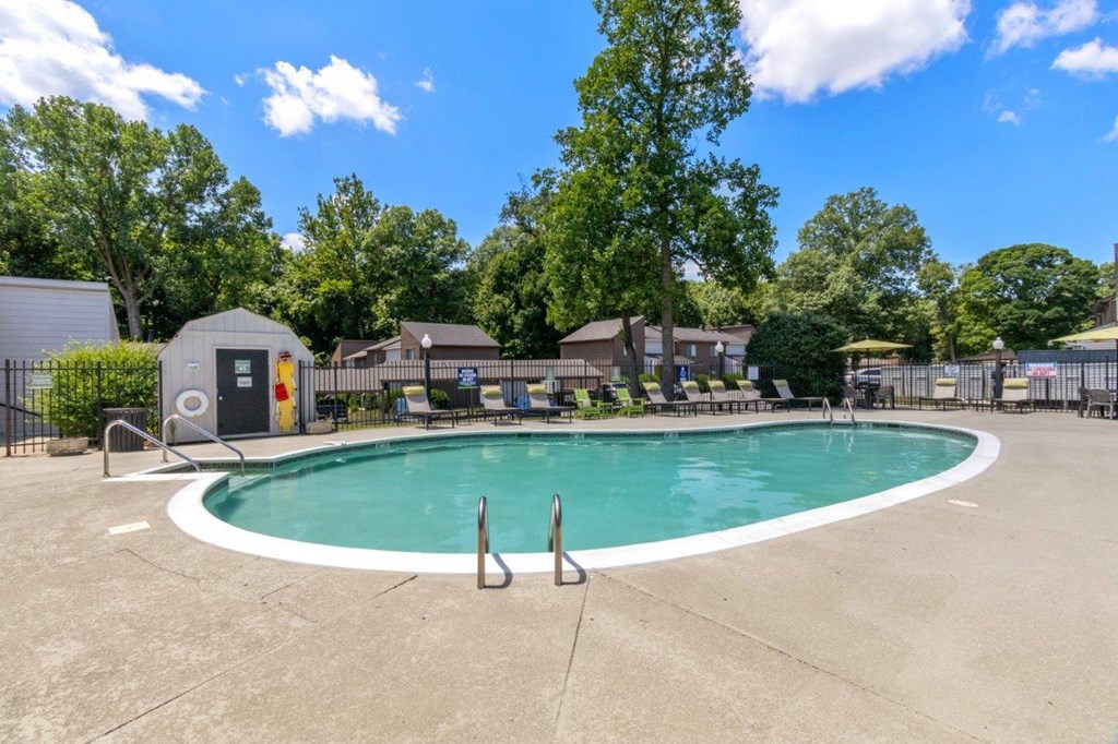 our apartments have a resort style pool with chairs around it