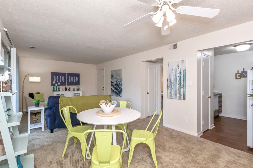 the interior of a restaurant with a large ceiling and some tables and chairs