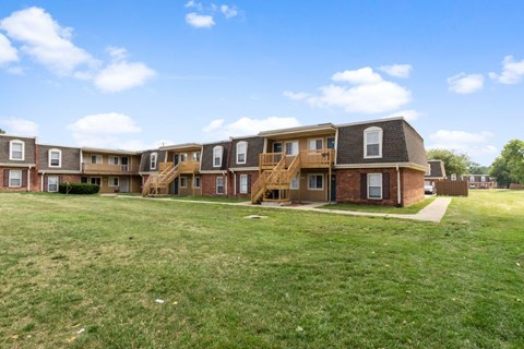 the view of an apartment complex with balconies and stairs