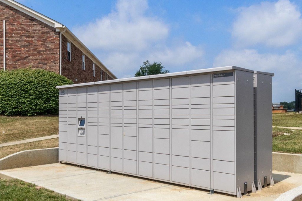 a small storage shed in front of a building